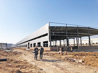 The UGT leadership team check the progress of their expansive new facility in Huaibei, China, earlier this year. It is almost ready to open, on schedule, in August this year.