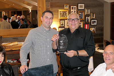 Father and son team Adam (left) and Leo Norich celebrate the company’s 30th anniversary, 1988 to 2018, with colleagues and family.